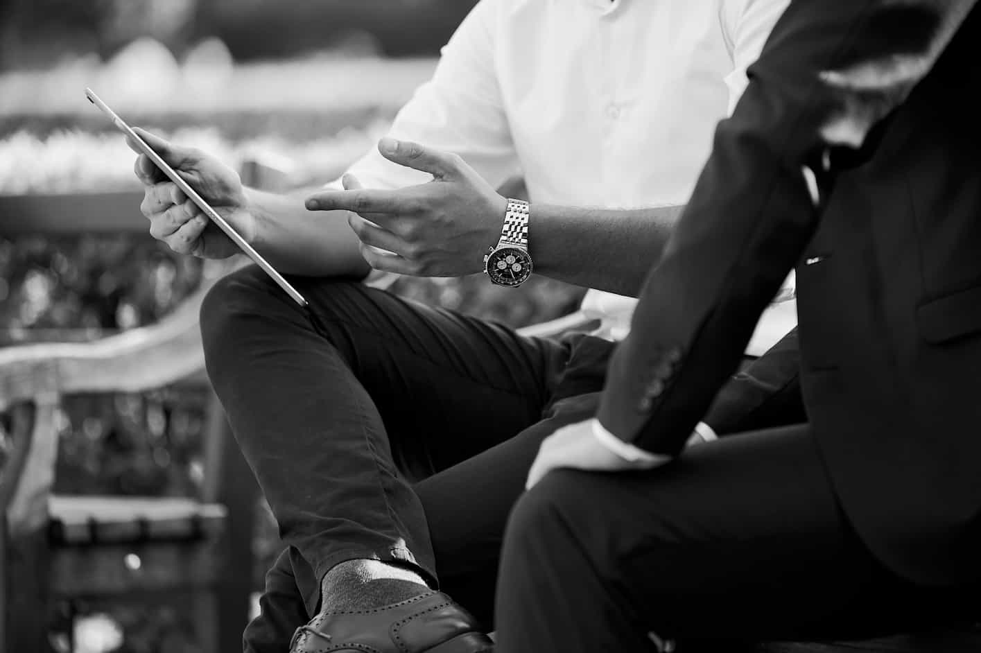 Businessmen looking at a tablet